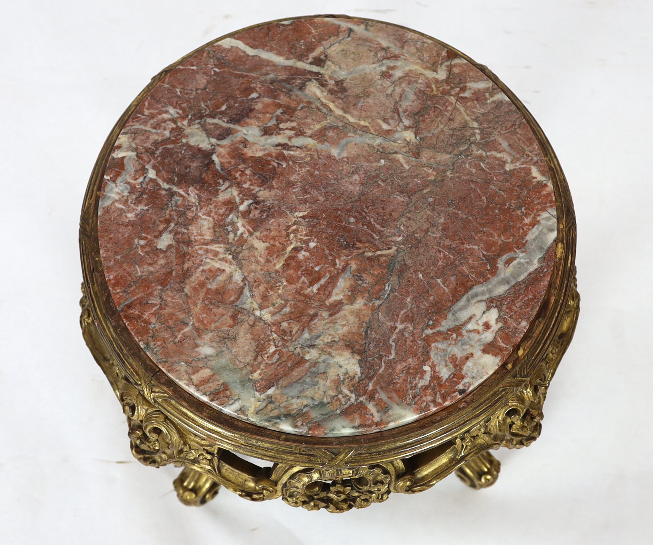 A Queen Mary giltwood and composition low stand, early 20th century, 56cm diameter, 53cm high, Please note this lot attracts an additional import tax of 5% on the hammer price